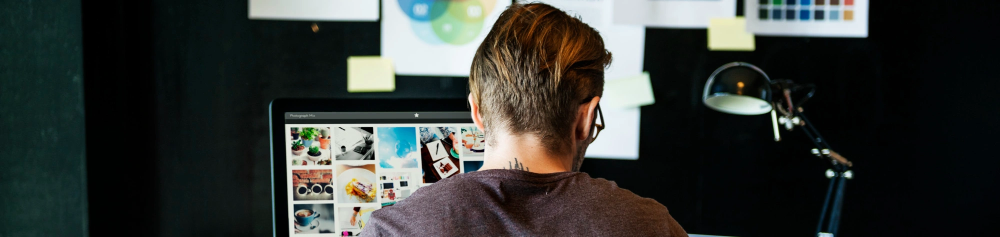 Print professional working on digital designs for business print management solutions